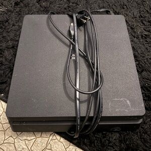 Sony Black Gaming Console with Cables